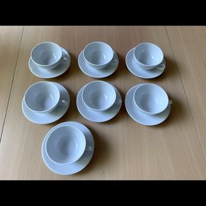 Set of 7 Pillivuyt teacups and saucers